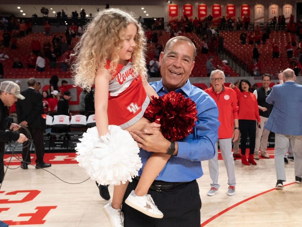 Maisy Jade and her grandfather — UH coach Kelvin Sampson — certainly enjoyed Houston's comeback win over Cincinnati. (Photo by F. Carter Smith)