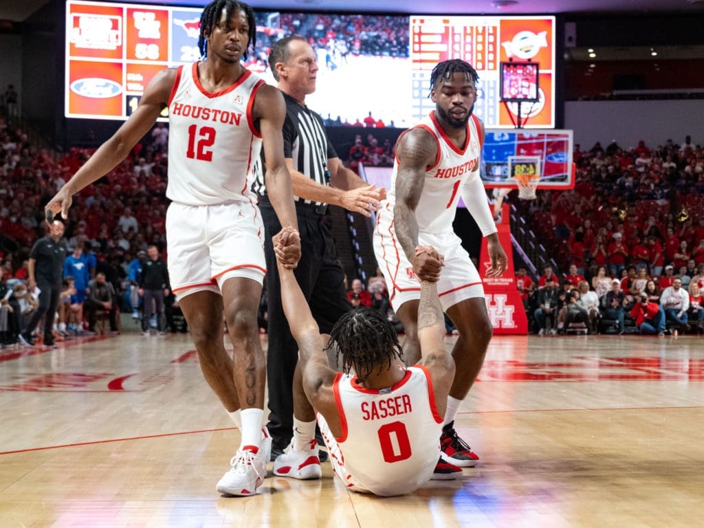 When any of their teammates fall down, UH's players will lift them back up. (Photo by F. Carter Smith)