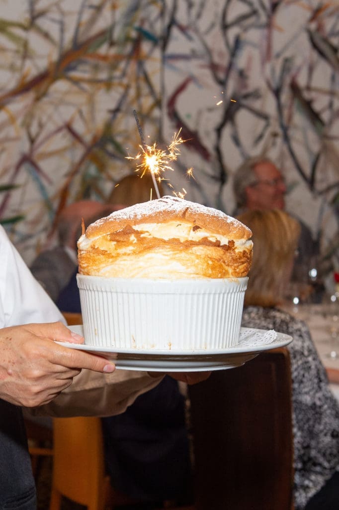 Tony's famed Grand Marnier soufflé making the rounds at the CanCare wine dinner. (Photo by Jacob Power)