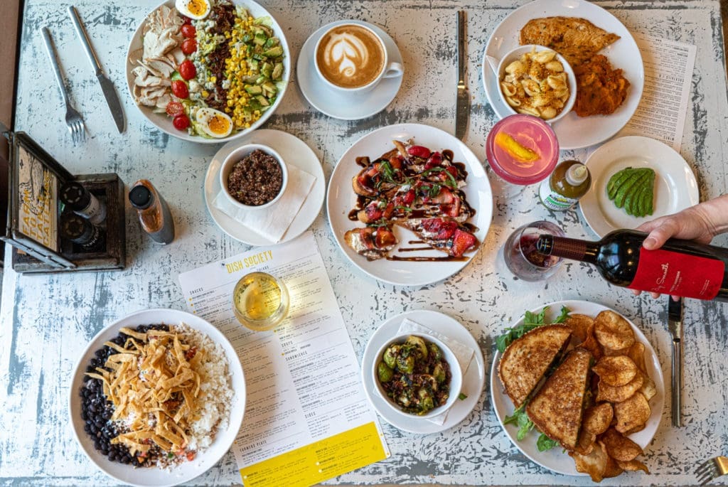 A table spread with fare from Dish Society, another Houston-born concept coming to Houston's Hobby Airport. (Photo courtesy of Dish Society)
