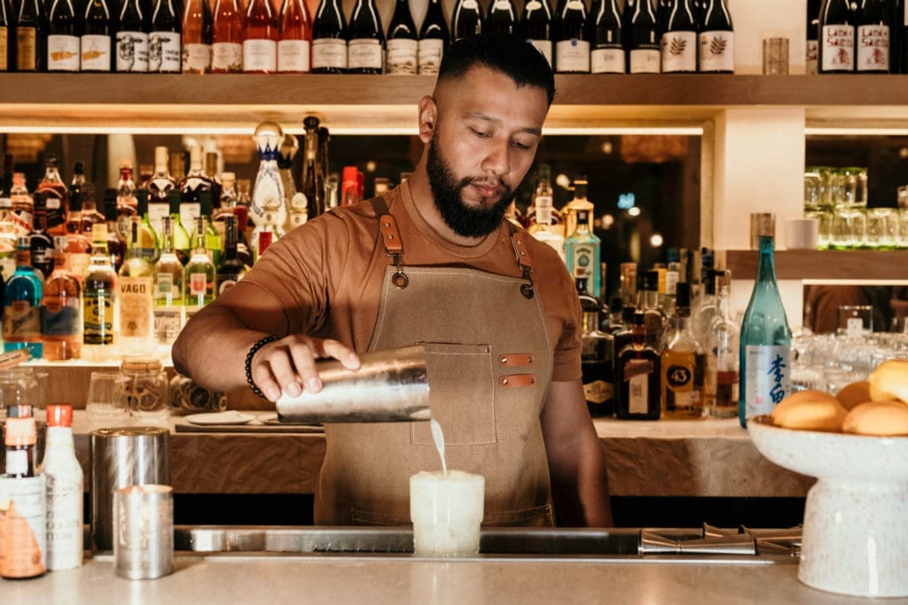 Behind the bustling bar at the new Montrose eatery, Graffiti Raw. (Photo by Kirsten Gilliam)