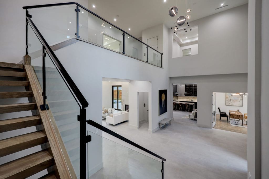 The two-story foyer in Levant Luxury Homes' latest project at 275 Pine Hollow Lane, represented by DeeDee Guggenheim Howes of Compass. (Photo by TK Images)