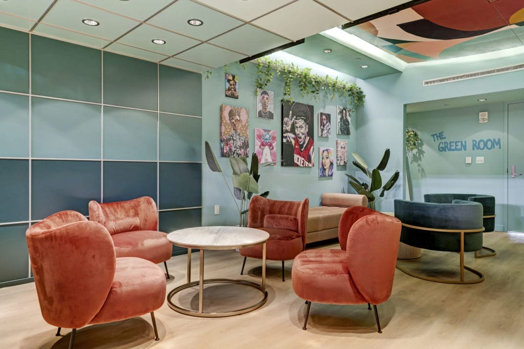 Contemporary furniture marks the luxe Green Room suite at Toyota Center (Photo by Courtesy of Gin Design Group)