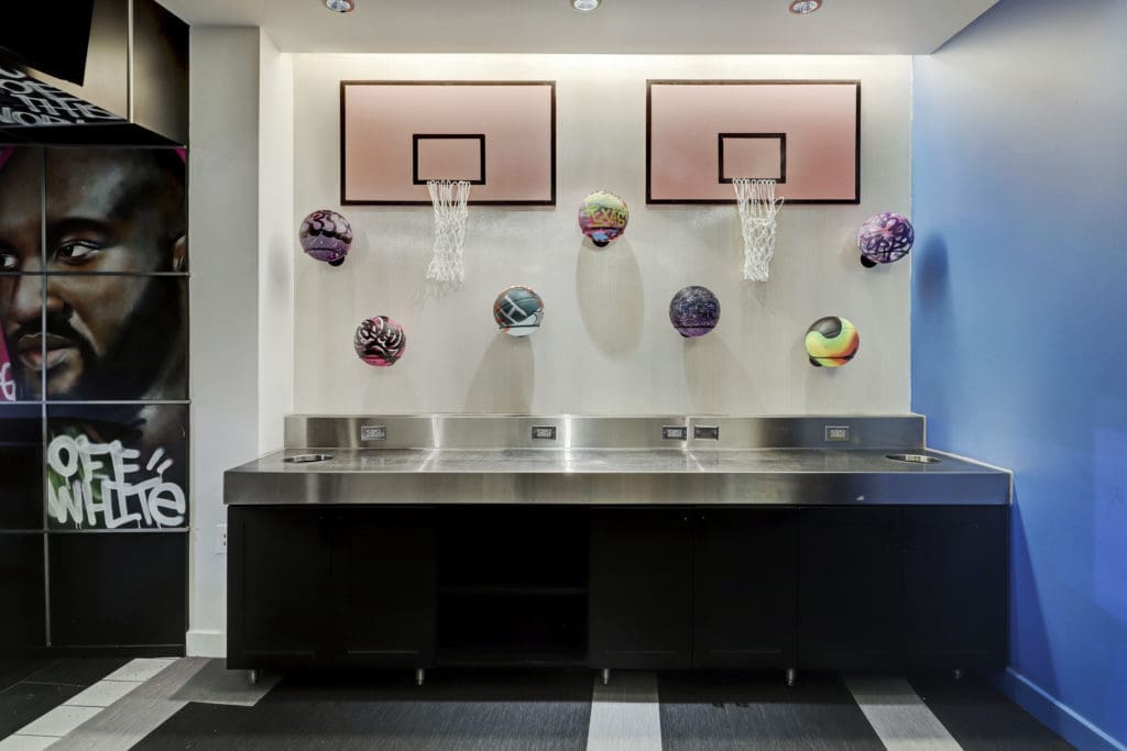 Artist rendered basketballs on display in the Sneaker Suite at Toyota Center (Photo by Courtesy of Gin Design Group)
