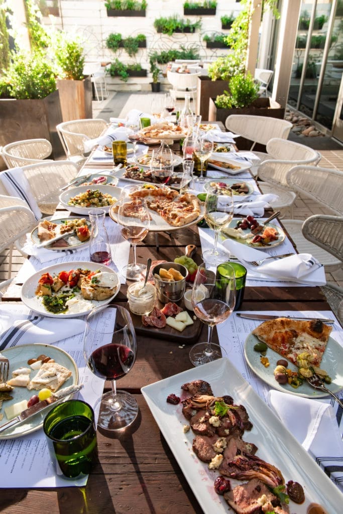 You can dine with friends and share wine and food at The Woodland's new Sixty Vines restaurant.