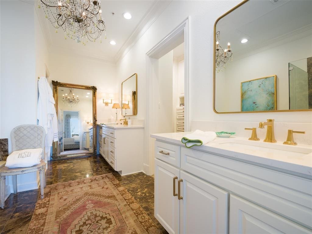 A fully renovated master bathroom features newly installed marble floors. 