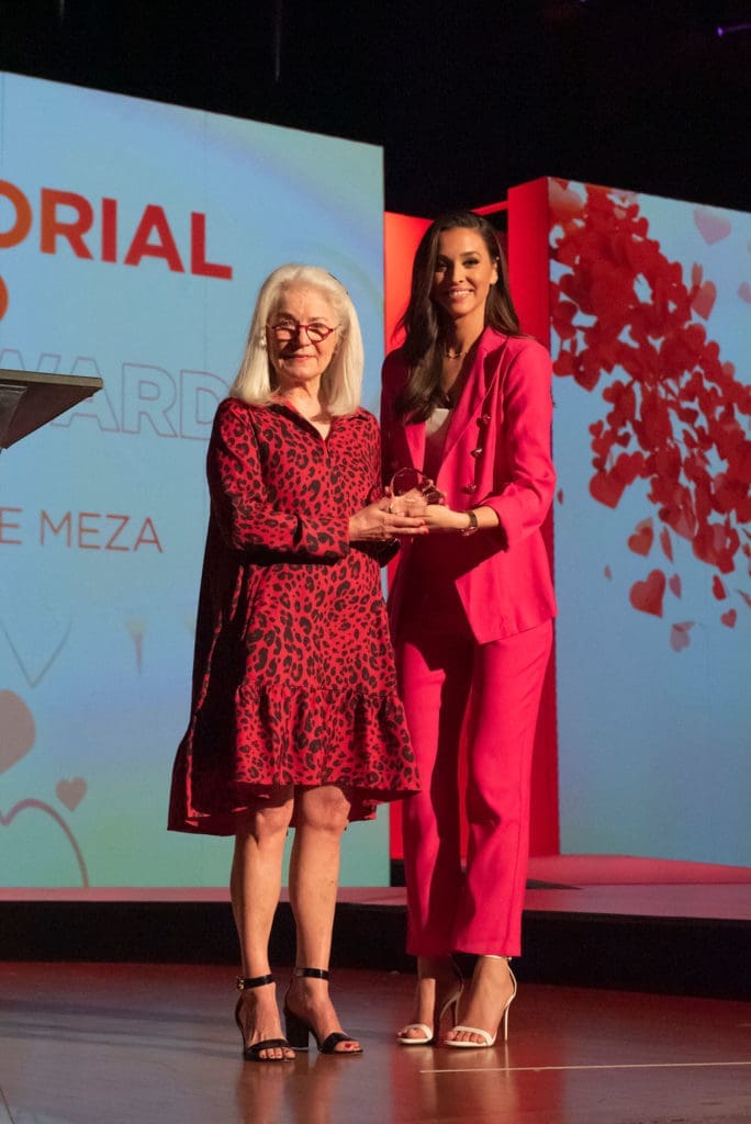 Teresa Meza accepting award for husband George Meza, 2023 Memorial Hero Award recipient
with emcee Hanna Battah (Photo by Tamytha Cameron)
