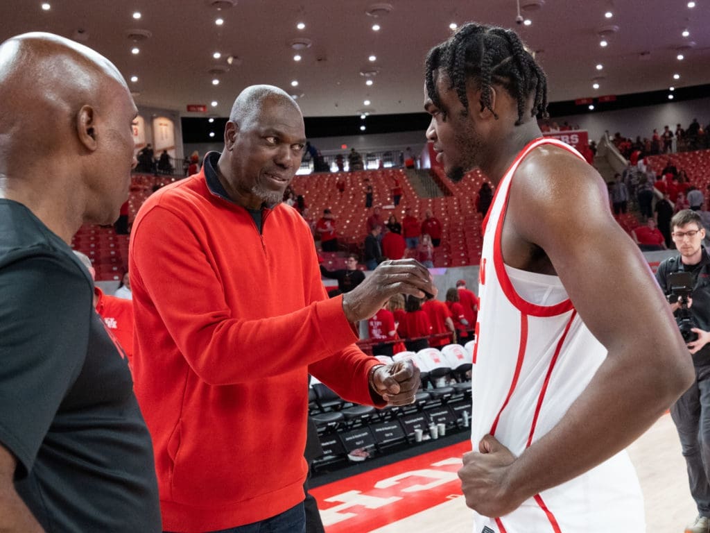 Hakeem Olajuwon is becoming a more and more of a regular presence at UH games. Here, he gives UH super freshman Jarace Walker some pointers. (Photo by F. Carter Smith)