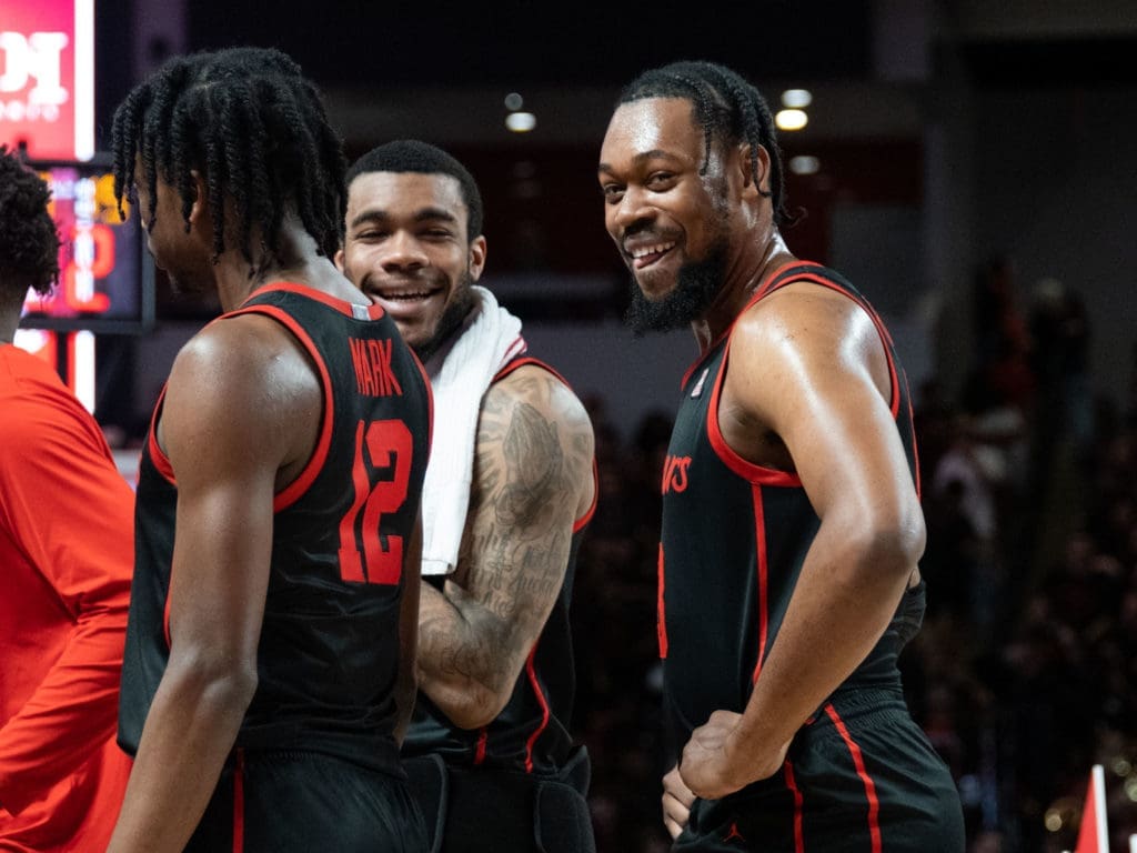 University of Houston forward Reggie Chaney (white towel) taught J'Wan Roberts plenty about toughness. (Photo by F. Carter Smith)
