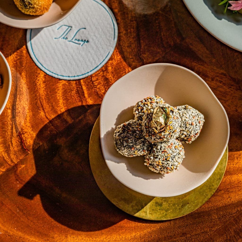 Foie Gras Loukoumades at the new lounge at March, which now serves mezze, cocktails, and wine on their Greek-inspired menu this season. (Photo by Zach Horst)