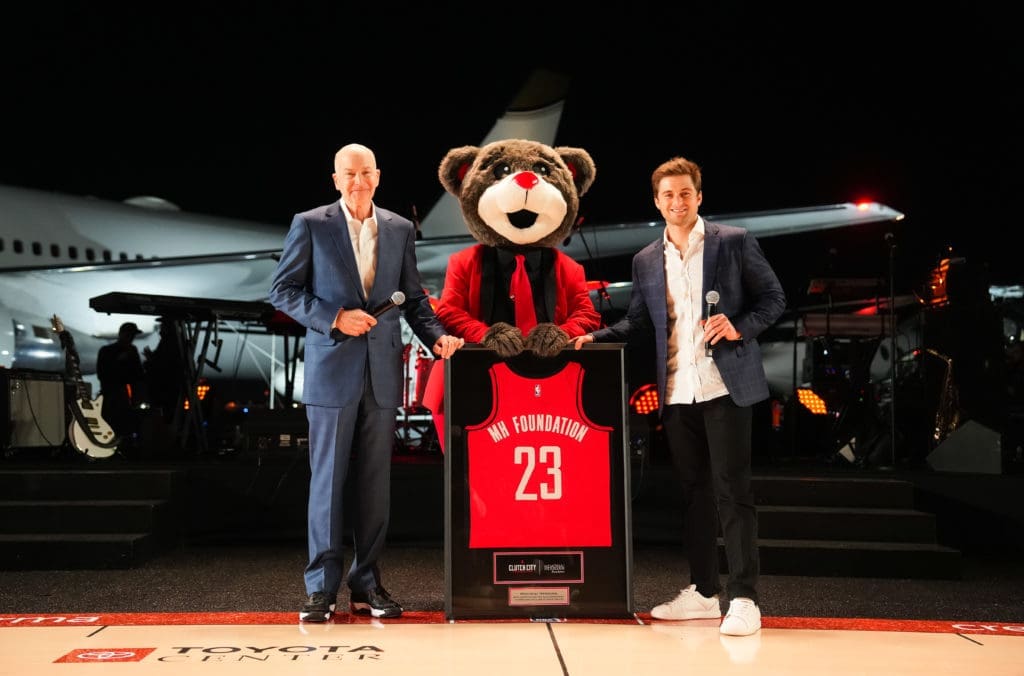 Memorial Hermann Health System president and CEO Dr. David Callender with Clutch and Patrick Fertitta at the Houston Rockets Clutch City Foundation gala at the Landry's hangar at Hobby Airport. That's the Rockets' jet in the background.