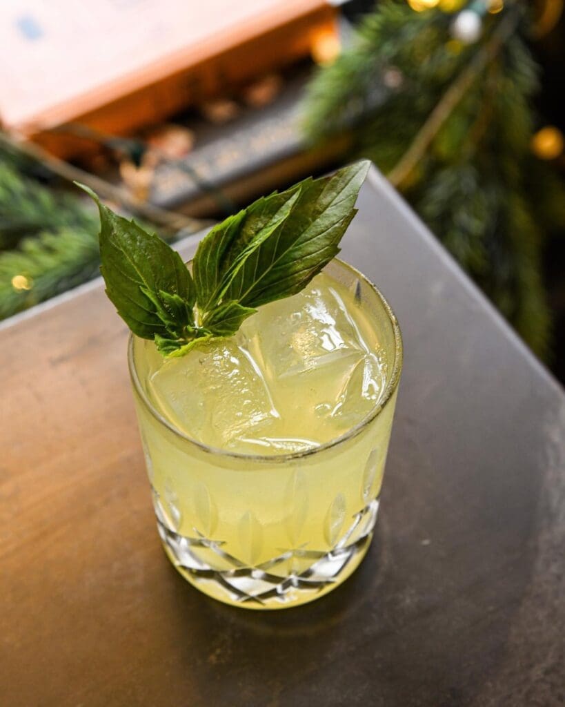 Mot Hai Ba's Thai One On is a lime leaf rum, Thai basil, green chartreuse, matcha, and a coconut rinse mixture. (Photo by Adriana Herrera)