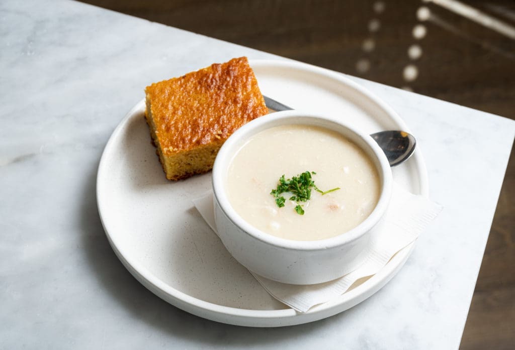 Served by the cup or the bowl with a side of warm cornbread, the Chicken and Dumplings is made from a family recipe that has been passed down through generations. Photo by Duc Hoang