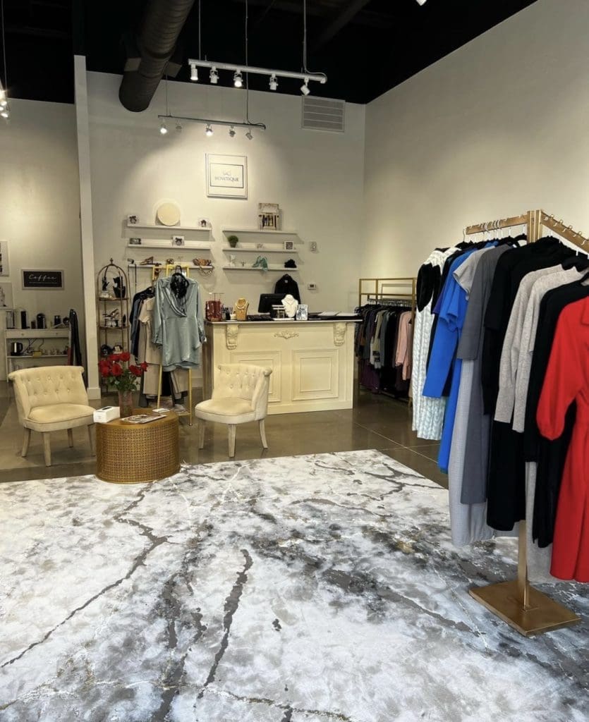 The interior is spacious and comfortable, with excellent lighting showcasing the clothing.