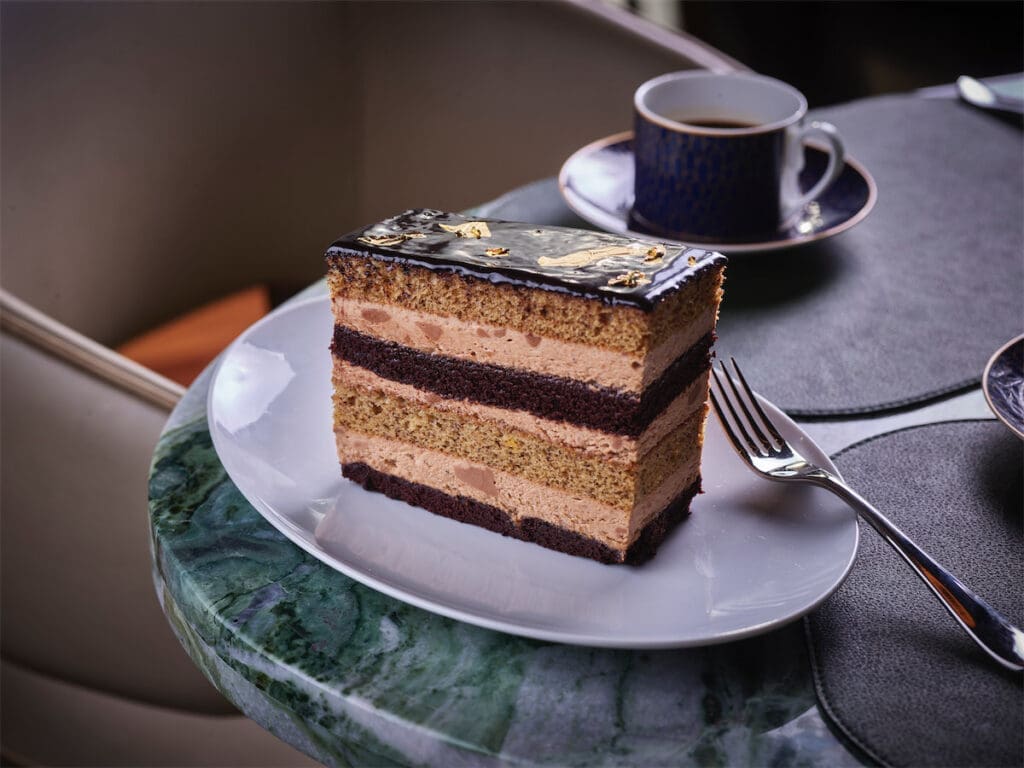 The Society Cake is a decadent chocolate and banana cake creation with gold flakes on top. (Photo by Bill Milne)