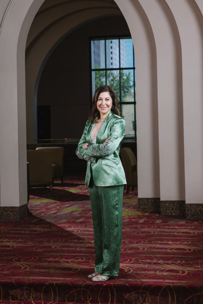 Jennifer Fink is wearing a Cinq a’ Sept blazer and pants from Tootsies. (Photo by Johnny Than)