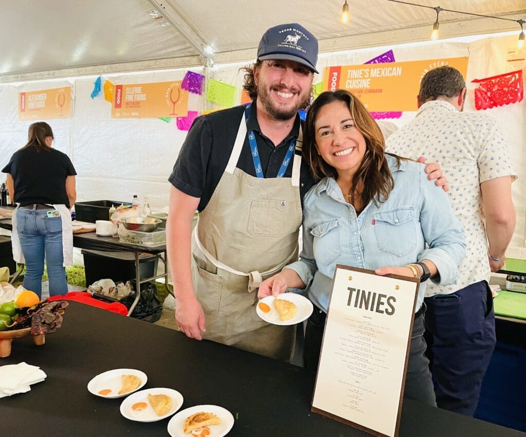 Christian Lehrmann and Sarah Castillo brought a flaky empanada from Tinnie's. (Photo by Courtney Dabney)