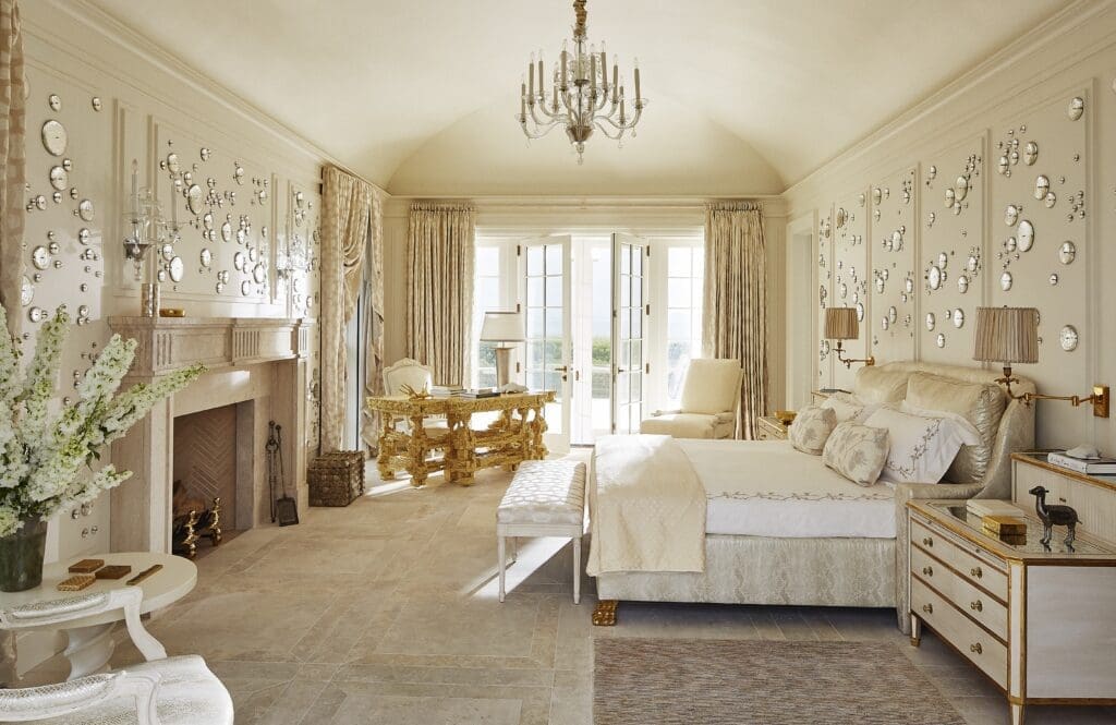 Rob Wynne bubbles dapple the walls of the main bedroom. The Venetian-glass chandelier came from R. Louis Bofferding, the desk is byChris Schanck Studio, and the bedside commodes are a Frederick P. Victoria & Son design. (Photo by William Abramowicz)