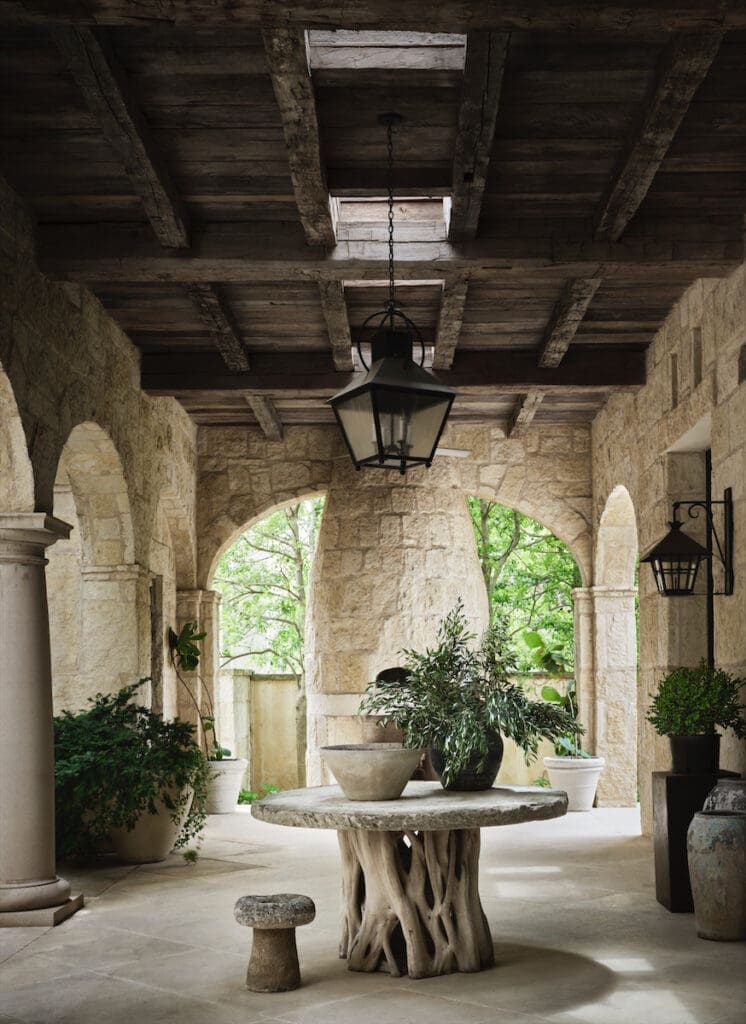 The loggia’s center table is custom-made from driftwood and concrete. (Photo by Douglas Friedman)