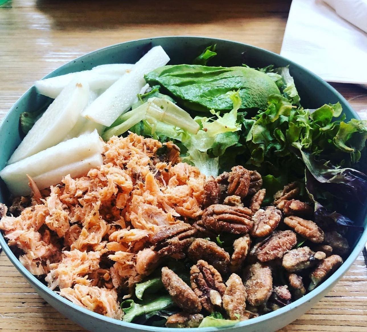 The smoked salmon salad with house made lemon truffle vinaigrette, candied pecans, jicama and avocado is on the menu at The Bearded Lady.