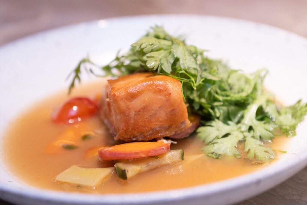 Chef Chris Shepherd and demi-soloist Syvert Garcia create Alaska king salmon Sinigang for Houston Ballet's Raising the Barre dinner fundraiser.  (Photo by Wilson Parish)
