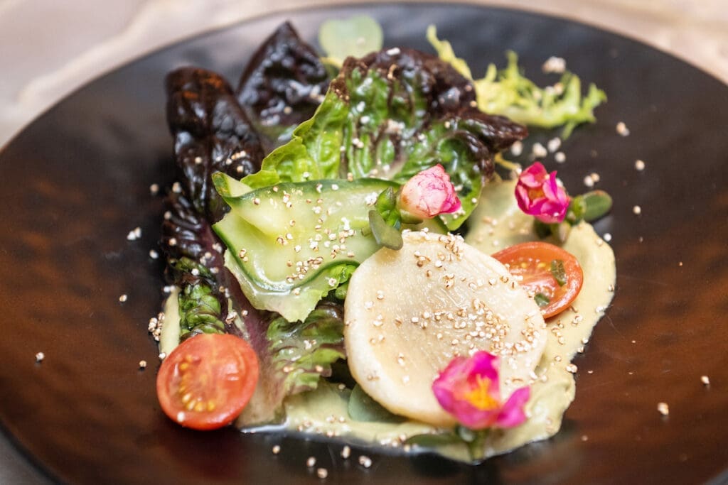 Chef Hugo Ortega and Corps de Ballet's Rafaela Henrique's Artichoke and Asparagus Salad  at Houston Ballet's Raising the Barre dinner fundraiser.  (Photo by Wilson Parish)