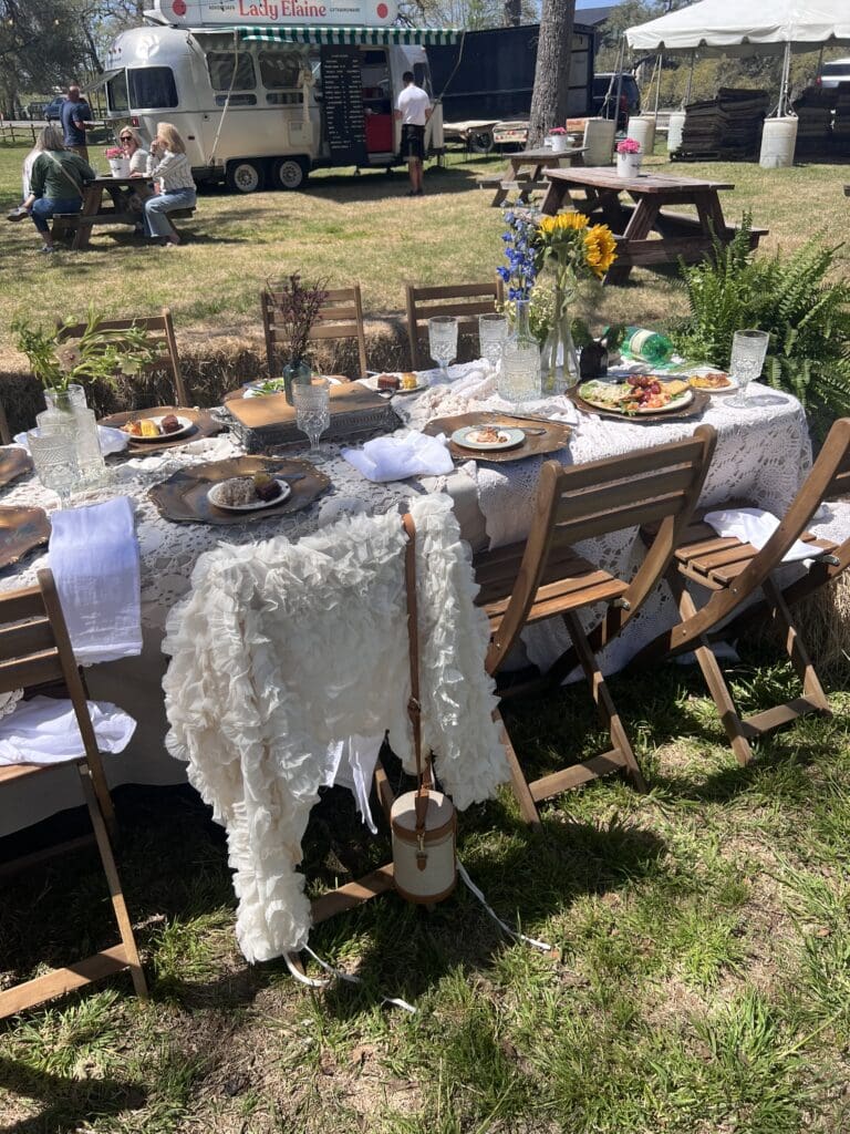 The "Hats and Hay Bales" luncheon set-up on the lawn of Junk Gypsy. 