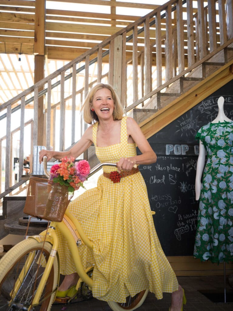 The fabulous designer Lela Rose poses on a flower-decked bicycle at the Recipe for Success Fashion in the Fields fundraiser. (Photo by Daniel Ortiz)