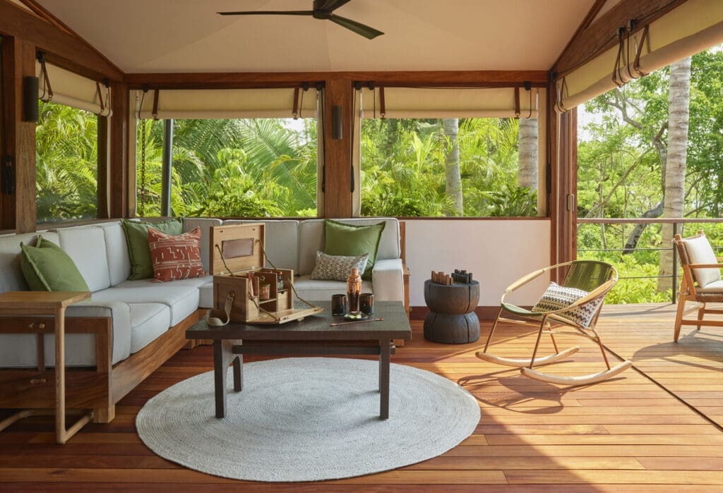 The screened in lounge area is a serene setting within Naviva's luxury tents. 