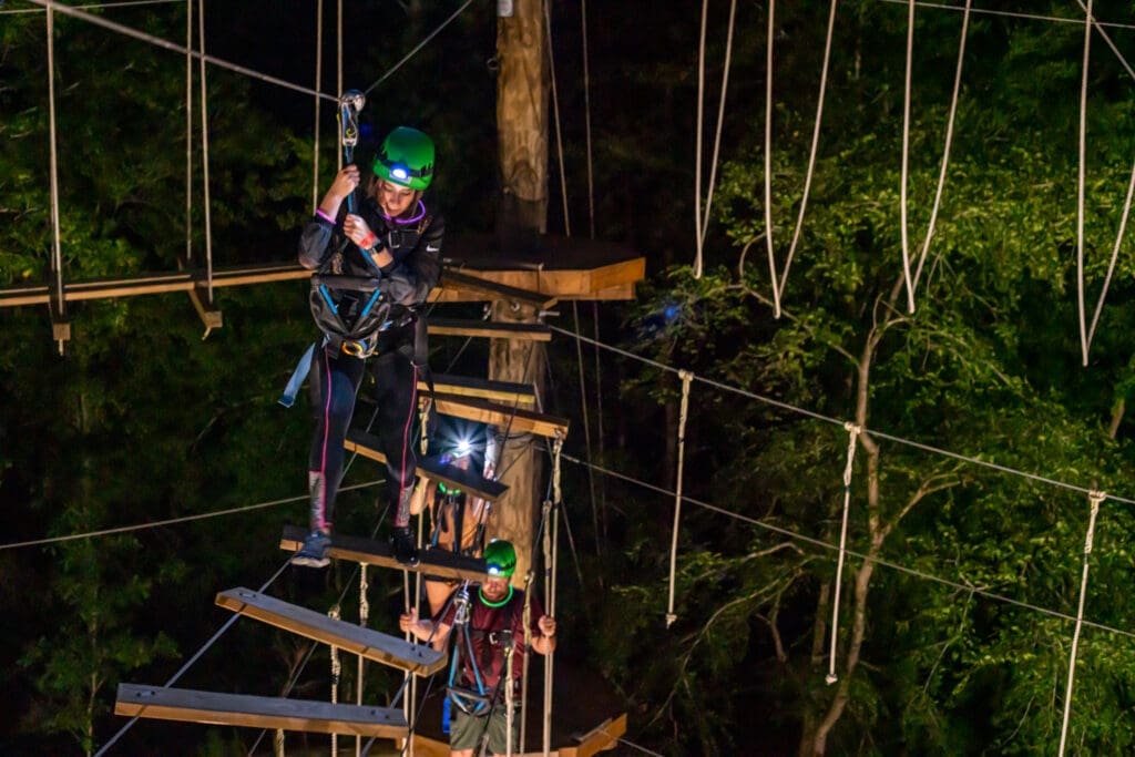 Night climbs add glow sticks and headlamps to the fun, while the elements are lit from below at TreeVentures.