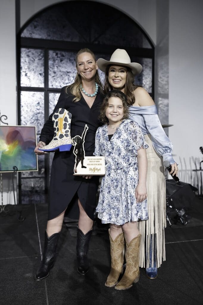Vicki Weyel, Taylor Sass, and Cancer Warrior Payton  at the Sky High for Kids banquet evening at The Revaire. (Photo by Quy Tran)