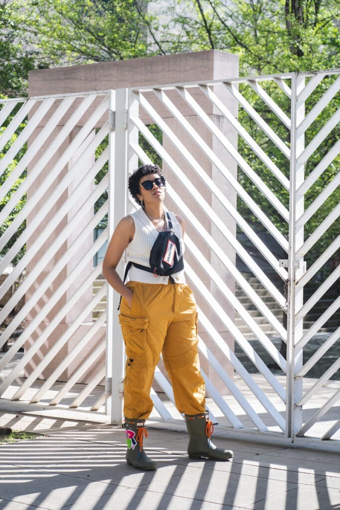 Sam Lao modeling her limited-edition Hunter Boot outside the Dallas Museum of Art. 
