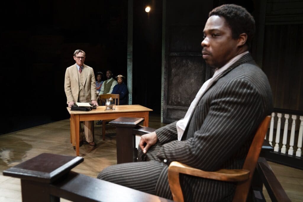 Tom Robinson (Yaegel T. Welch) takes the stand in a powerful scene from To Kill a Mockingbird. (Photo by Julieta Cervantes)
