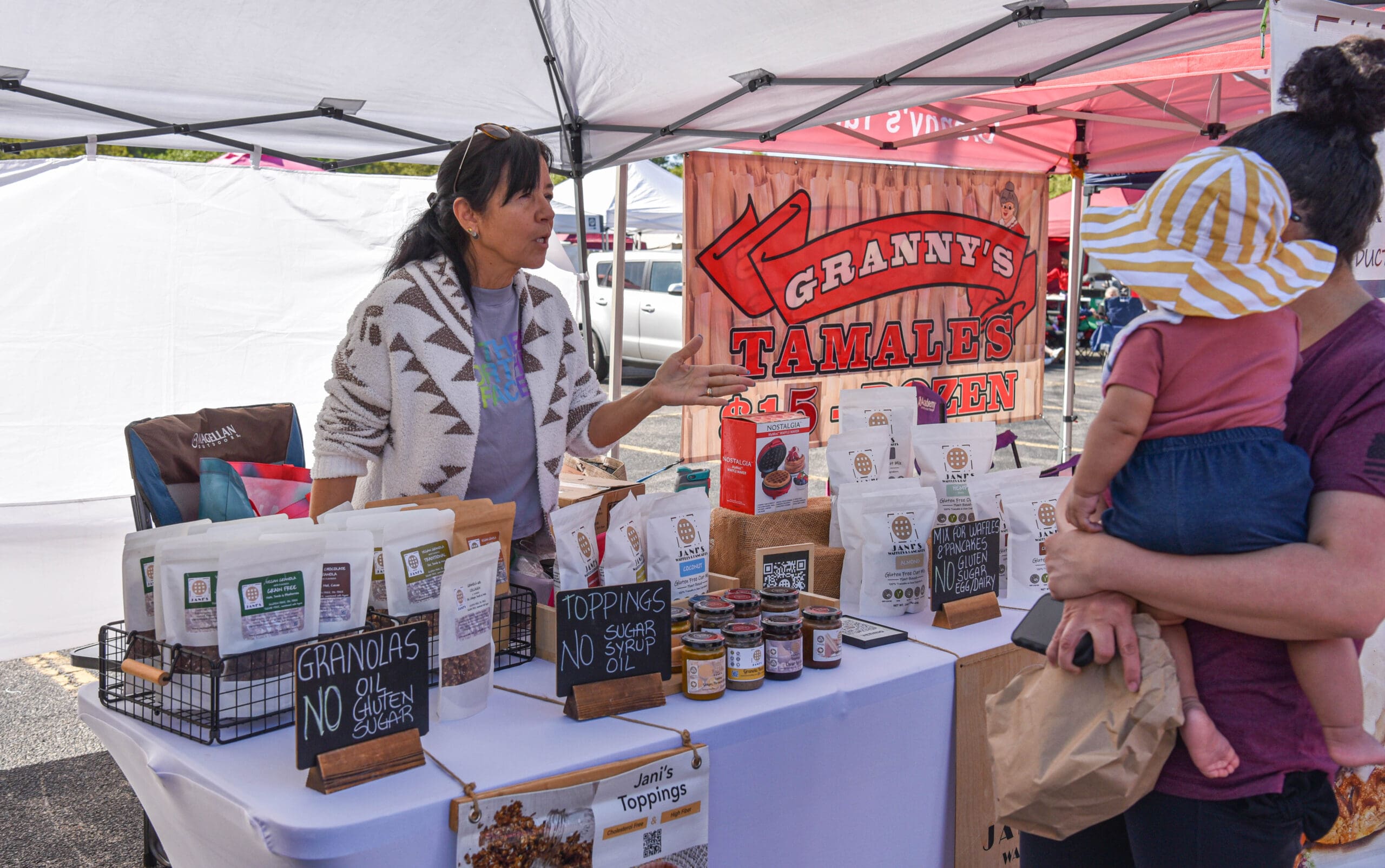 Woodlands Farmers Market visitors can browse vendor booths while shopping. (Photo by Jessica T. Payne)