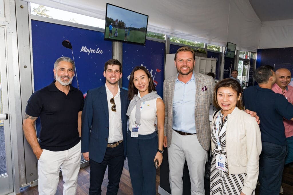 Lonny Soza, Blake Fertitta, senior VP of events for IMG Winnie Heng, president of Rolls-Royce Motor Cars Americas Martin Fritsches, Elizabeth Wan make the scene at the Rolls-Royce Chevron Championship event. (Photo by Doris Paniagua)