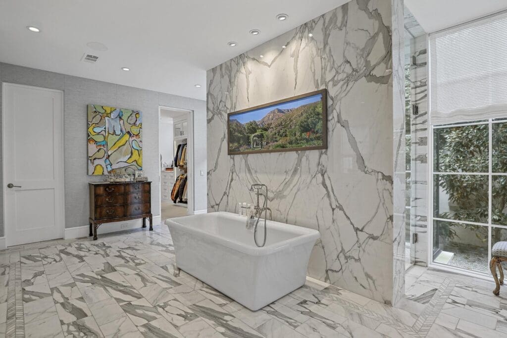 Luxury meets elegance in the marble bathroom.