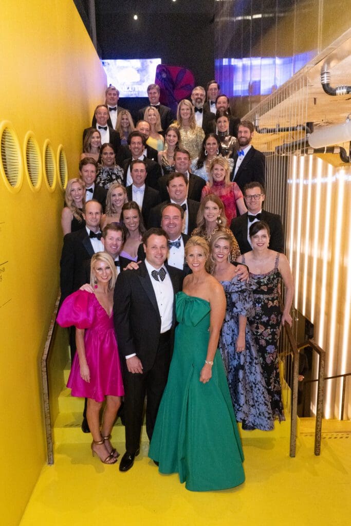The Children's Fund board gathers on a stairway at 713 Music Hall for the Children's Fund 'An Evening of Mystère!' gala (Photo by Wilson Parish)