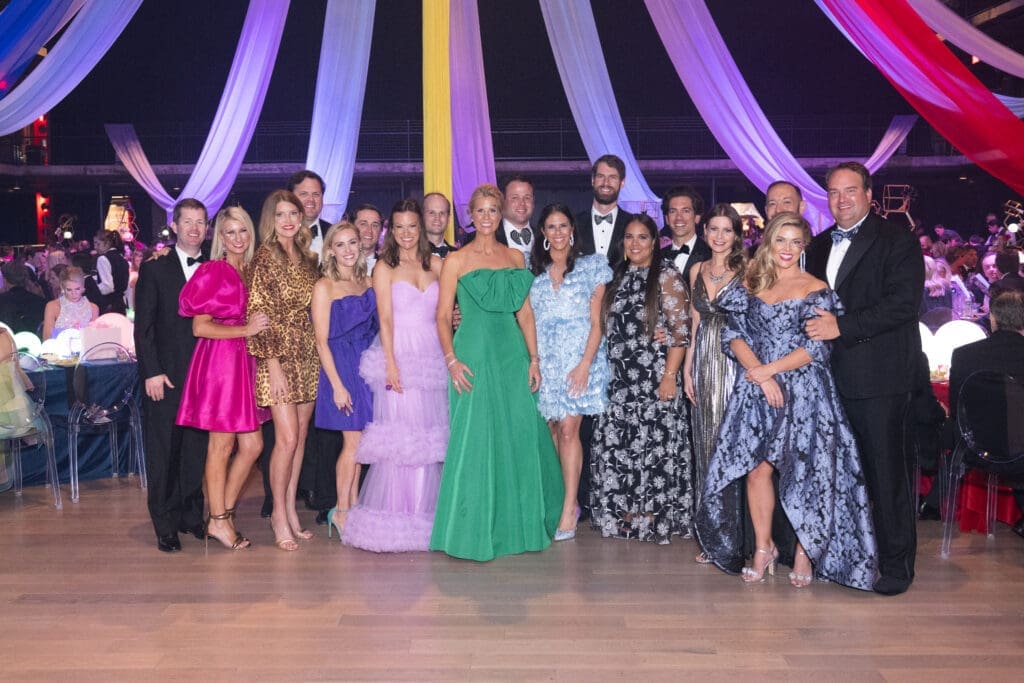 The Children's Fund events team lines up a group photo at the Children's Fund 'An Evening of Mystère!' gala held at the 713 Music Hall (Photo by Wilson Parish)