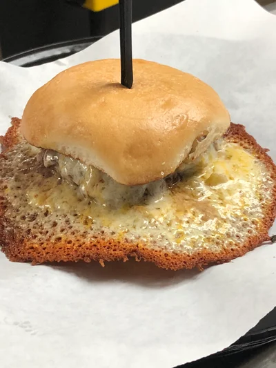 Fuego Burger is a dramatic with its cheese halo.