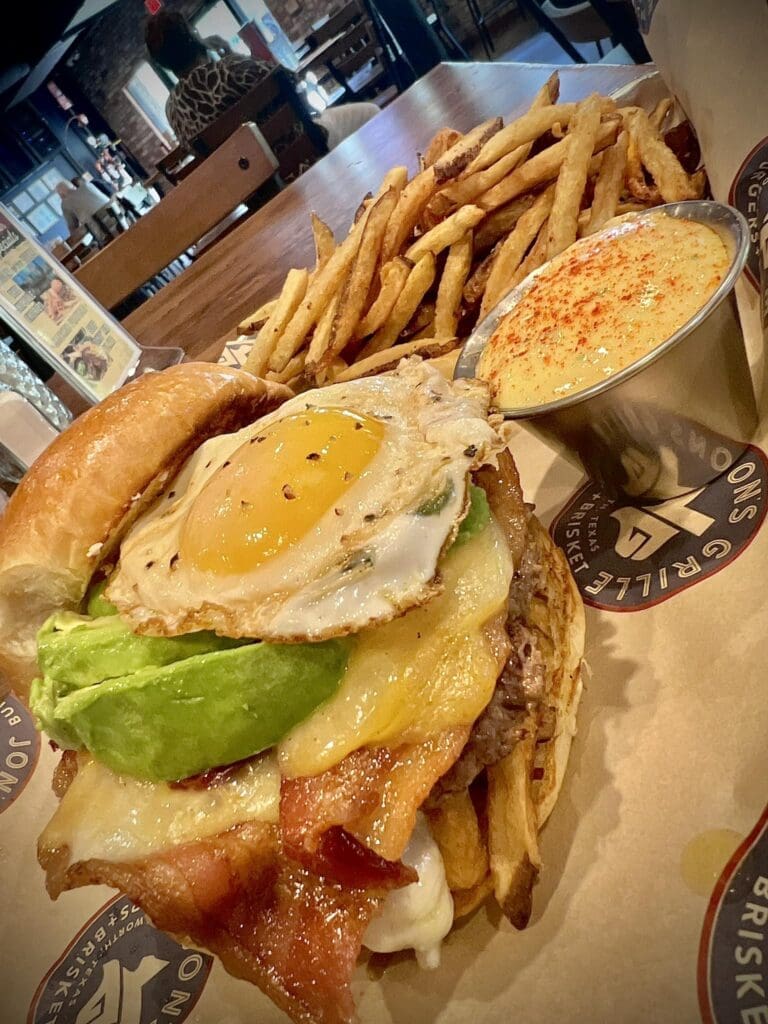Jon's Grille features the Texas Sunrise with bacon , fries, avocado, farm fresh egg and a side of Hollandaise.