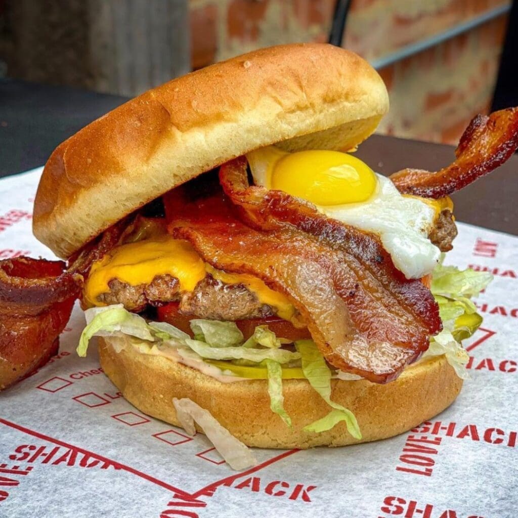 The Dirty Love Burger is still a staple at Love Shack topped with a quail egg.
