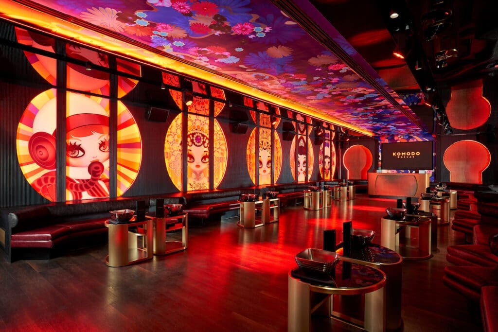 Slip into a booth to enjoy bottle service, DJ sets, and sparkler parades. (Photo by Kevin Marple)