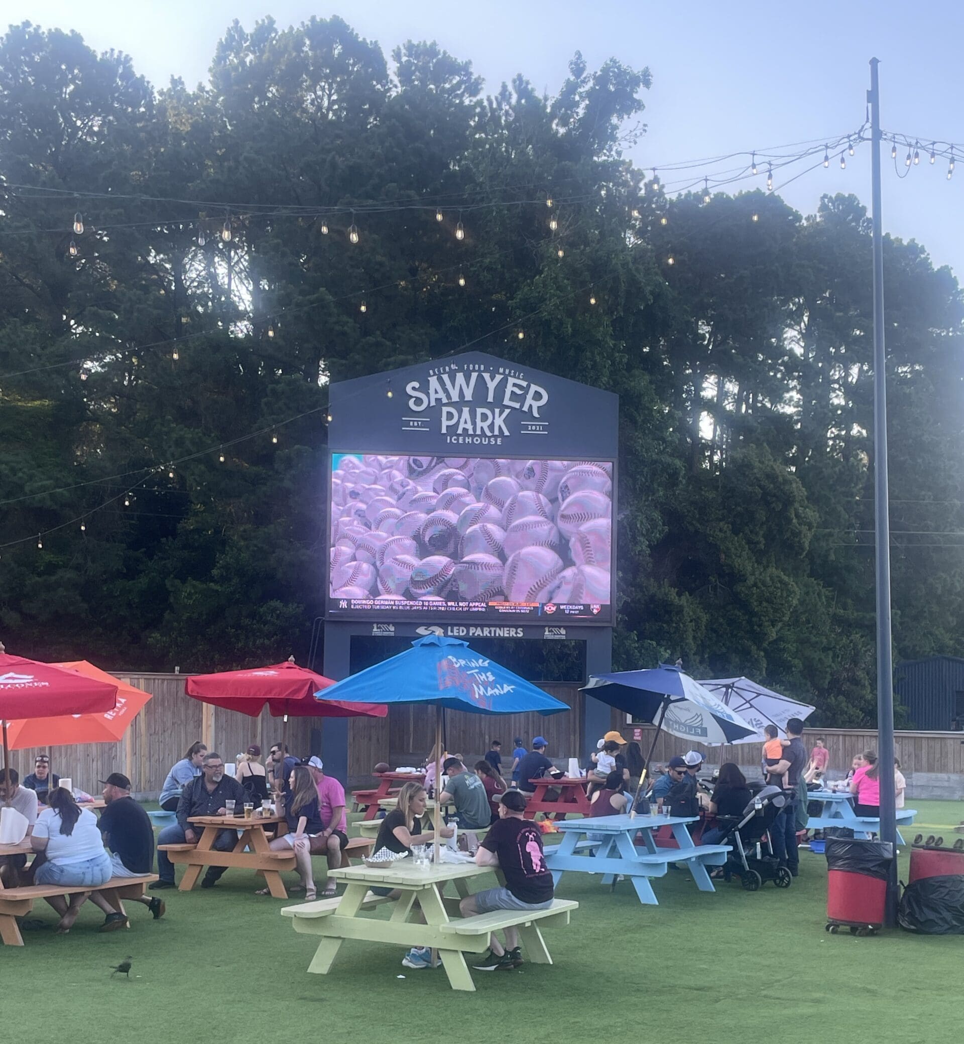 Sawyer Park's big outdoor screen is always tuned to a major sporting event.