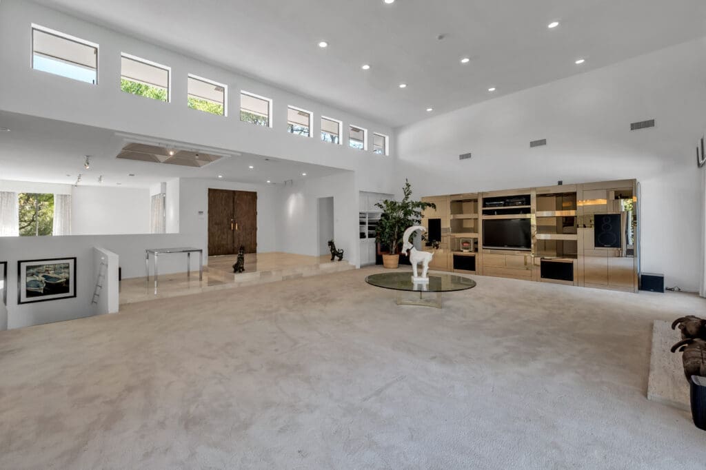 The sleek, mod and light filled living room.