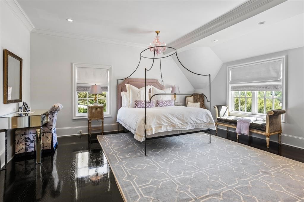 One of the other upstairs bedrooms flooded with natural light at 5700 Westover Court.