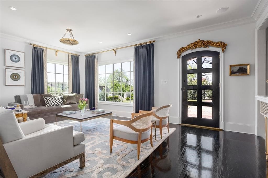 The main entry reveals the black lacquered wood flooring that graces many rooms.