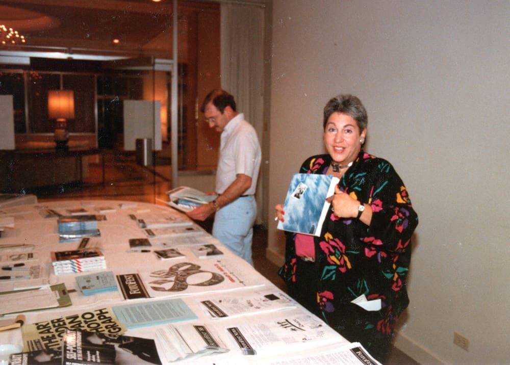 FotoFest Executive Director, Harla Kaplan, at the information
table of the 1988
festival (Courtesy Harla Kaplan)