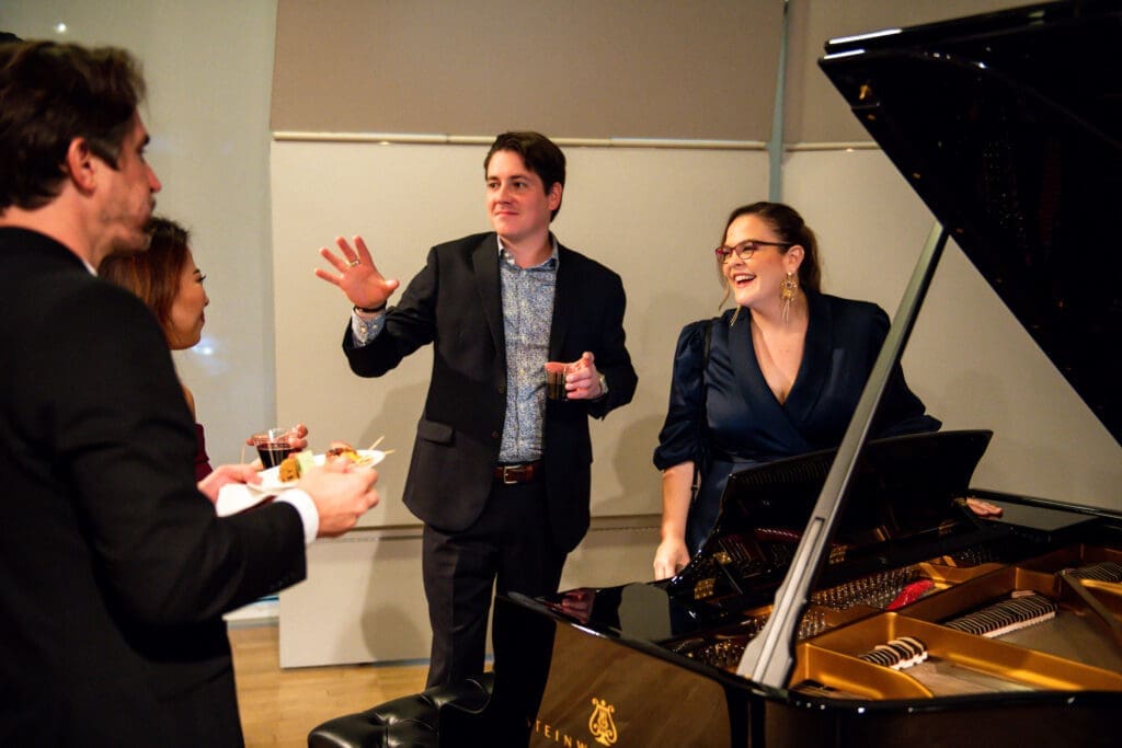 Piano specialist with Steinway Piano Gallery Amanda Watson visits with guests following the physician's concert at MATCH. (Photo by Matthew Rood)