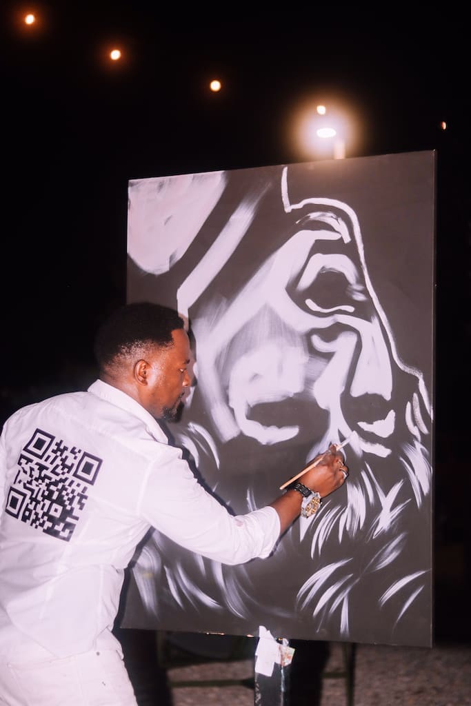 Artists Ange Hillz painted a Tina Turner portrait at the SEBAS Foundation Live Fire Event in Houston.