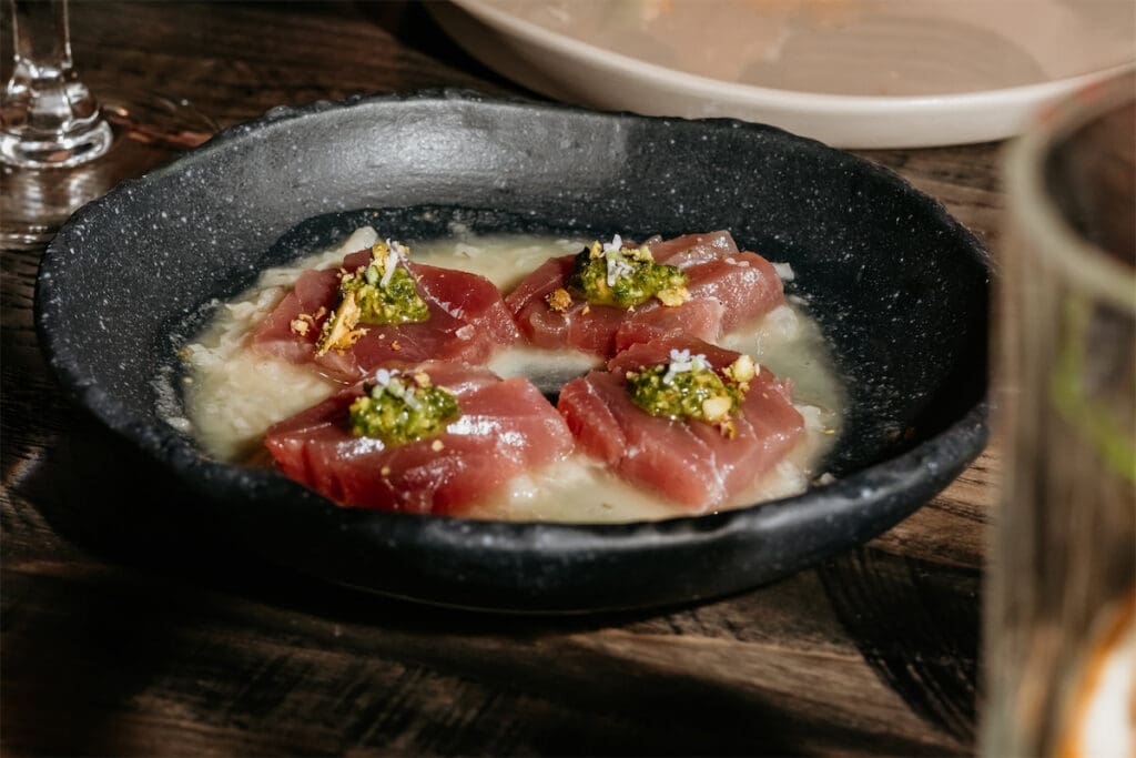 Start with the Bluefin Tuna Crudo with pistachio pesto at The Saint. (Photo by Kayla Enright)